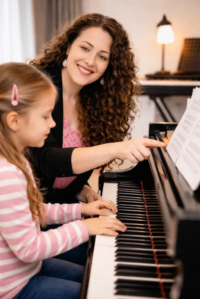 Private piano lesson for a child in Zug, Switzerland, with an experienced piano teacher guiding note reading and technique